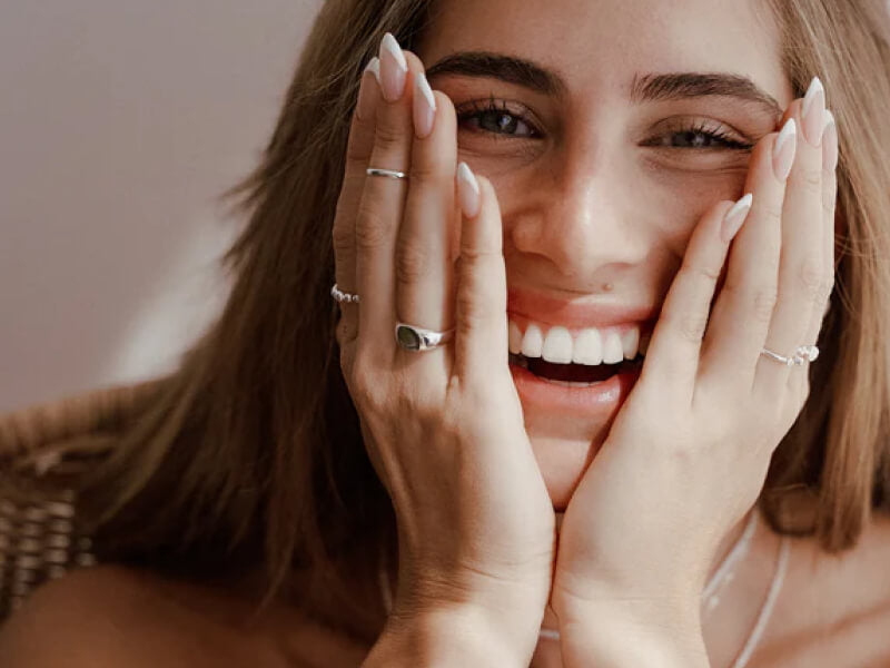 woman with jewelry smile